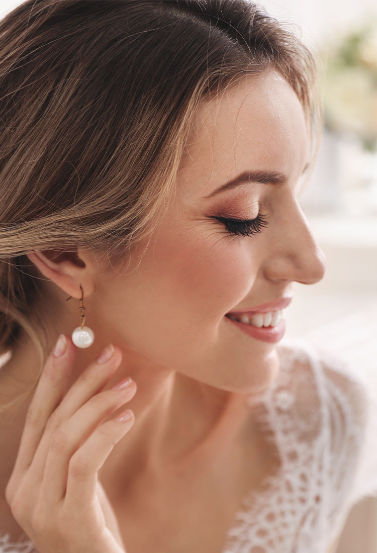 happy bride wearing jewelry